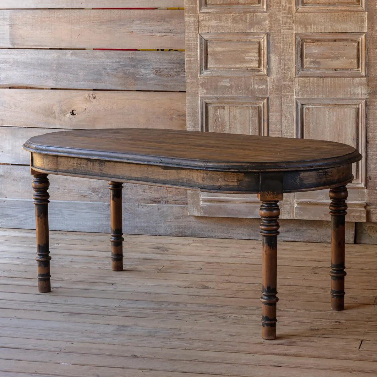 Aged Black Oval Dining Table
