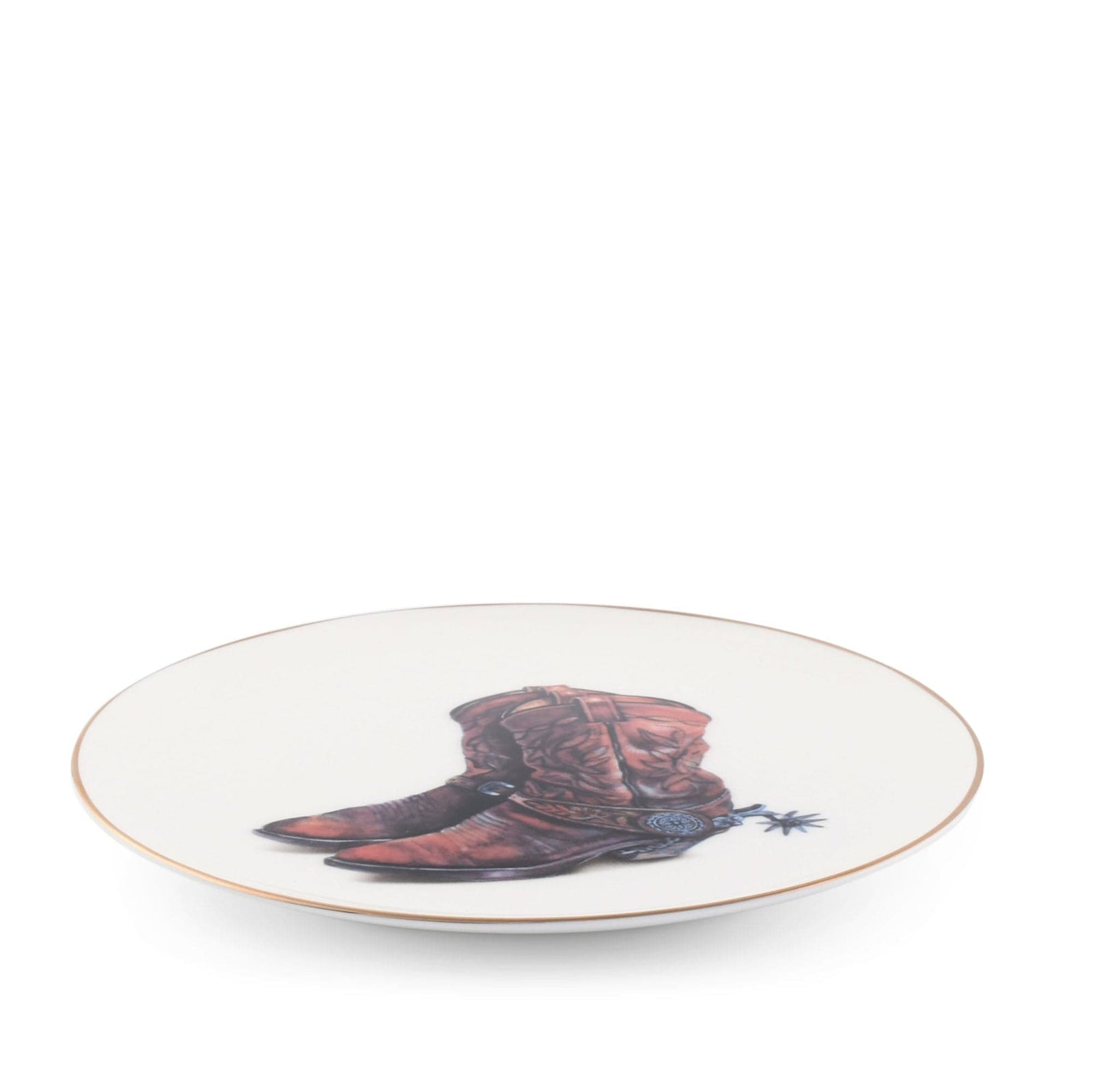 Round plate with a design of brown cowboy boots on a white background
